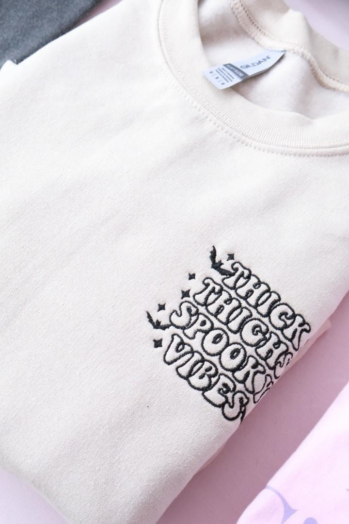Thick thighs spooky vibes crewneck
