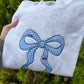 Blue bow mockneck
