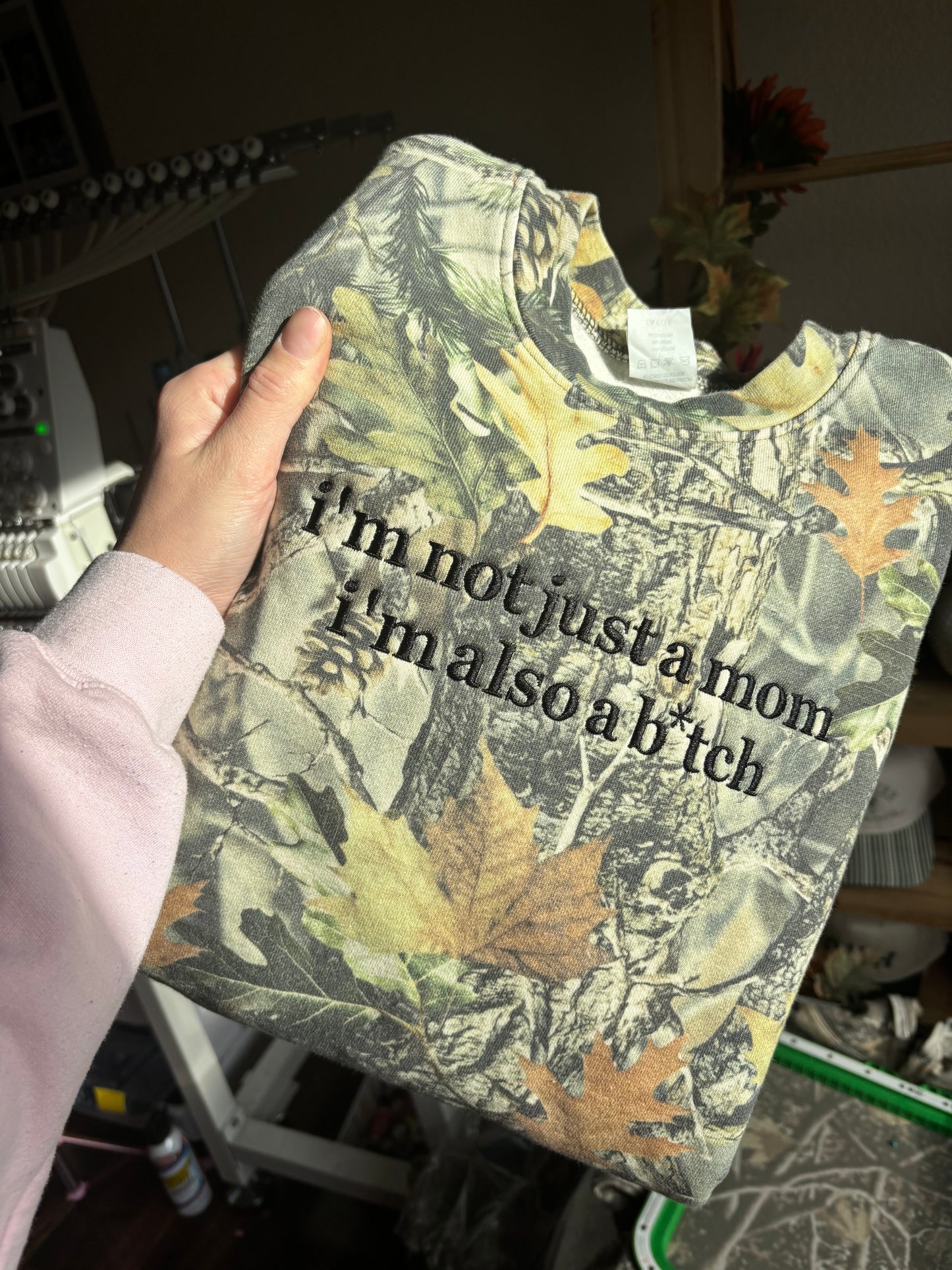 I’m not just a mom camo CREWNECK